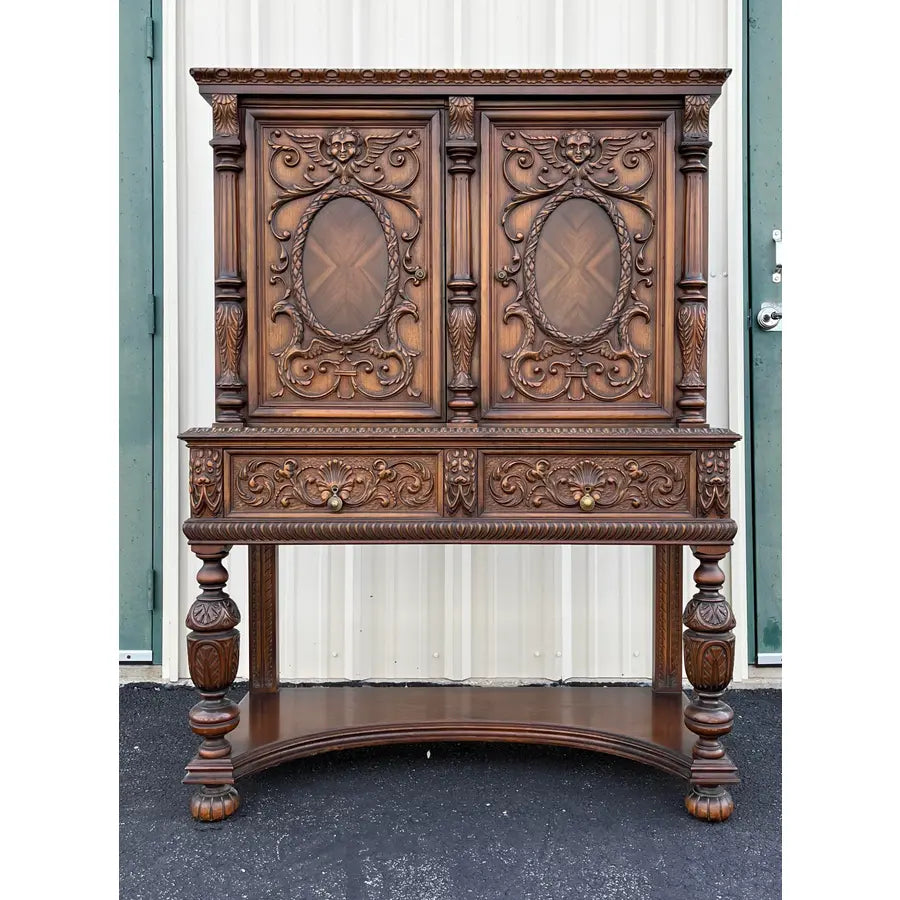 1910s Revell & Co Jacobean Carved Walnut Dining Cabinet
