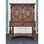 1910s Revell & Co Jacobean Carved Walnut Dining Cabinet
