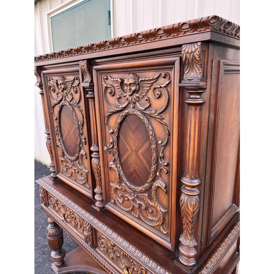 1910s Revell & Co Jacobean Carved Walnut Dining Cabinet