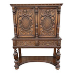 1910s Revell & Co Jacobean Carved Walnut Dining Cabinet