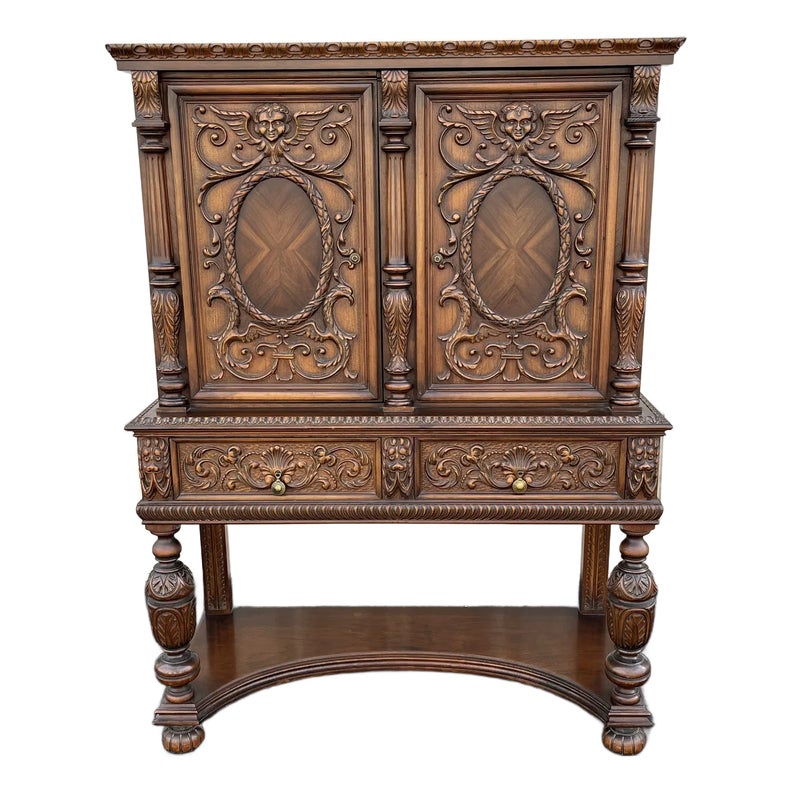 1910s Revell & Co Jacobean Carved Walnut Dining Cabinet