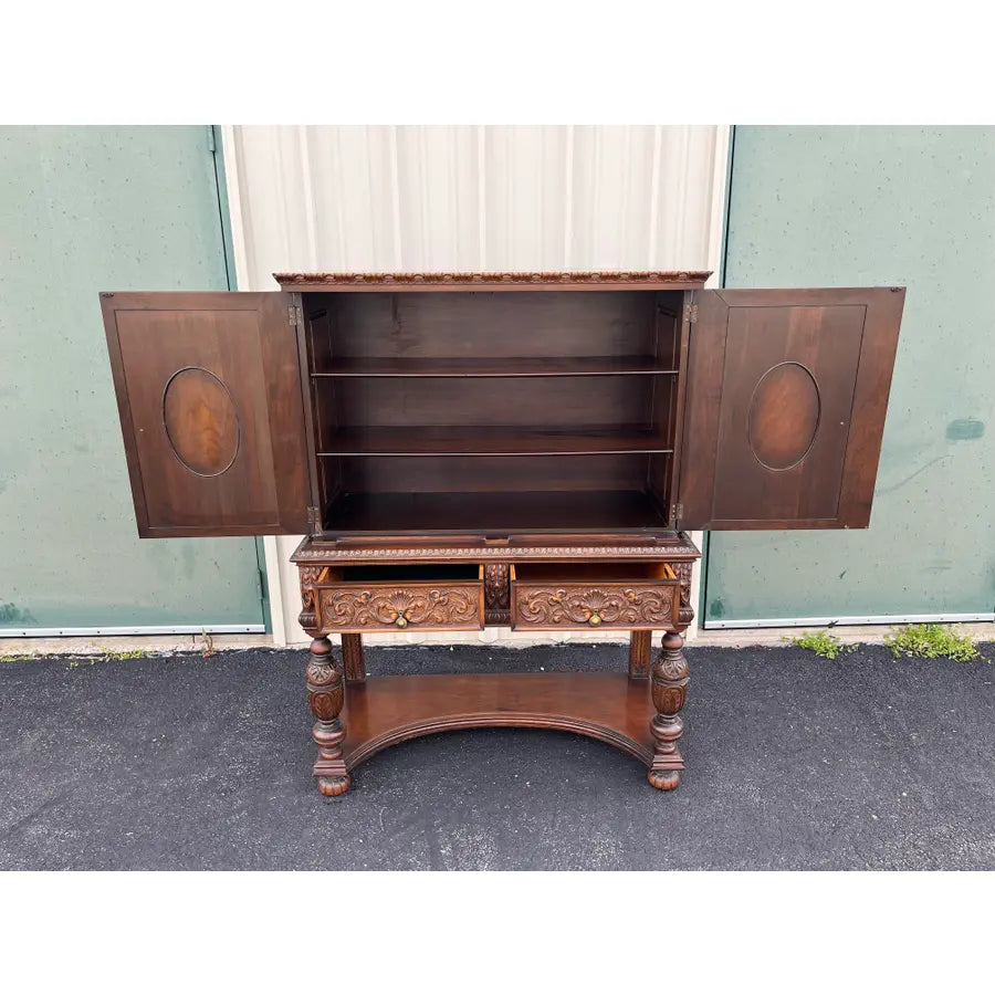 1910s Revell & Co Jacobean Carved Walnut Dining Cabinet